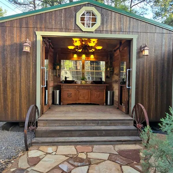 Finished shed interior with rustic furniture and decor